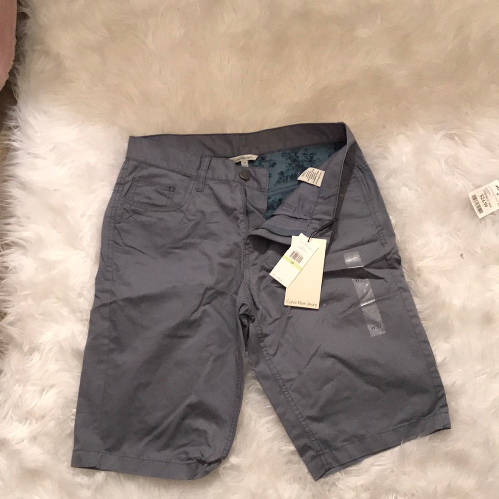 MENS Calvin Klein grey Bermuda shorts.